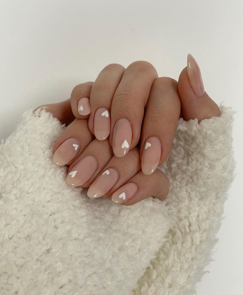 valentines nails nude with white hearts