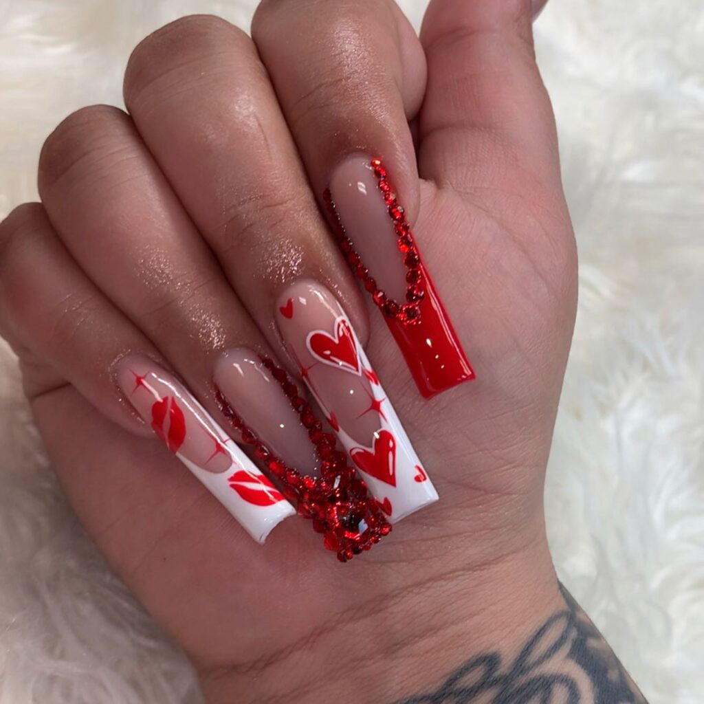 valentines nails with red gemstones and hearts